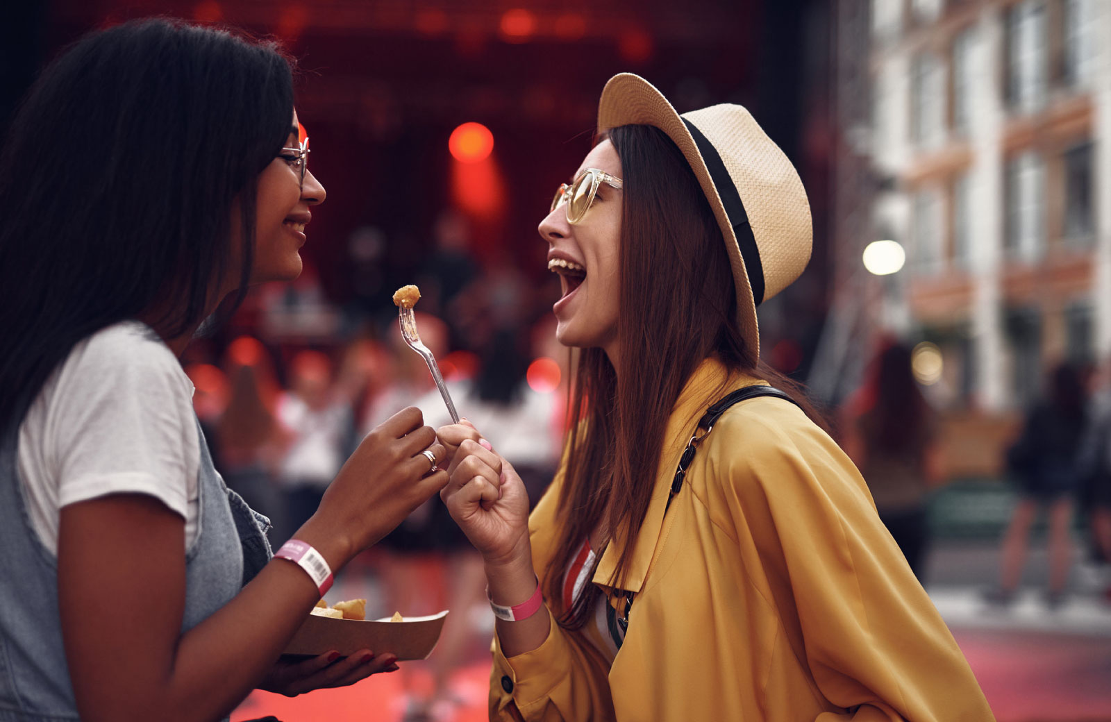 two girls sharing food