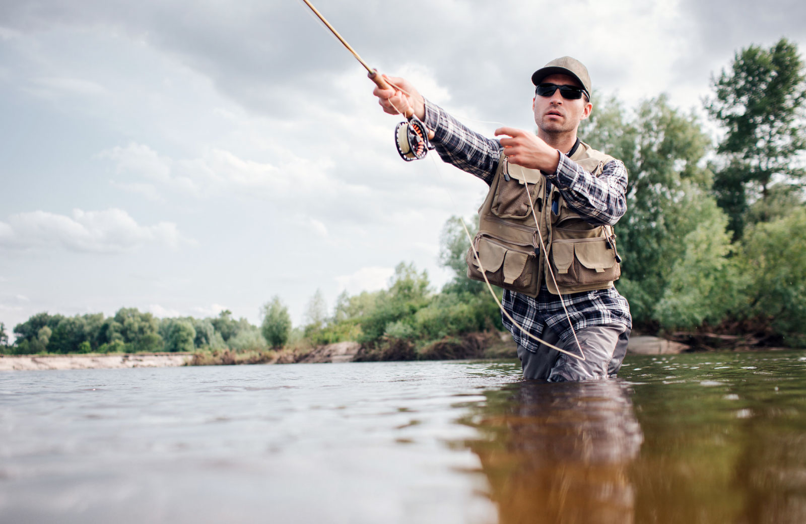man fishing in a river