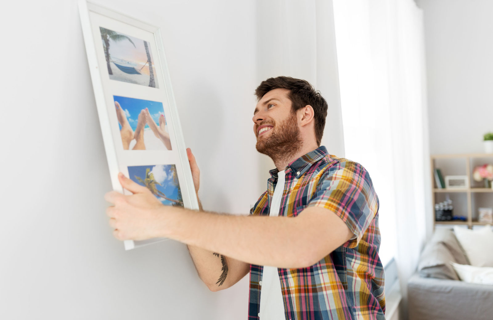 man setting up house decor