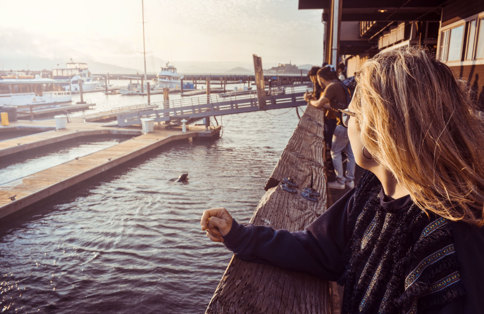 people hanging out at the pier