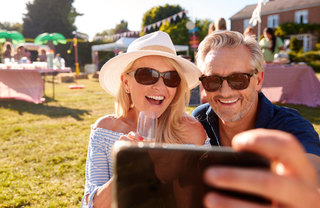 A couple taking a selfie at a food festival