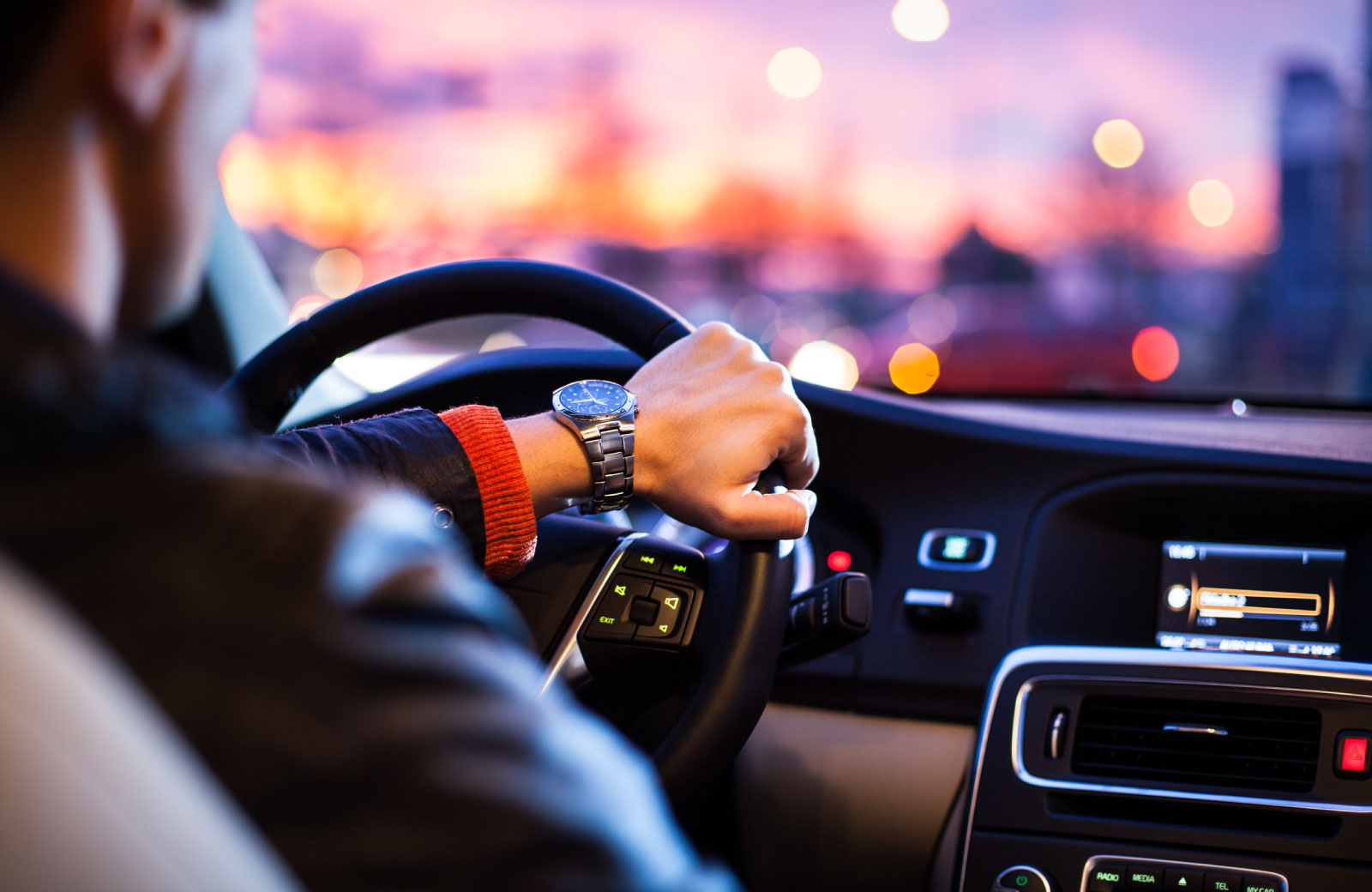man driving a car