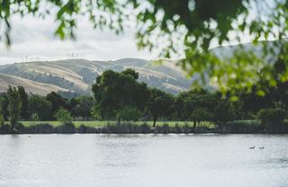 view of Lake Elizabeth with east bay hills in the distance