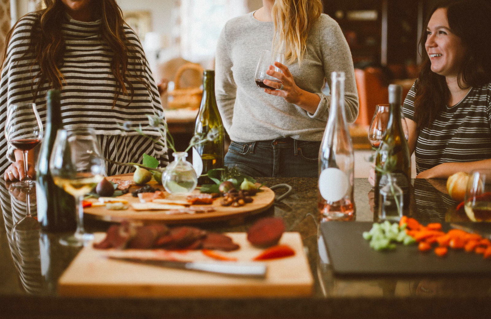 group of women dining out drinking wine