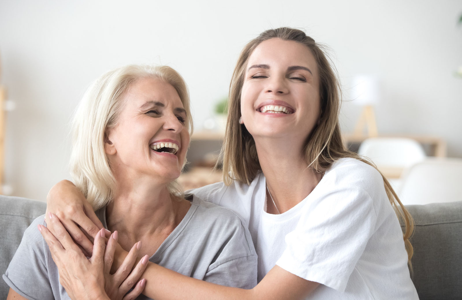 woman with mother smiling and hugging