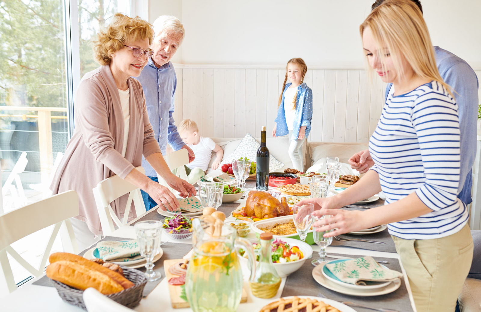 family preparing food table for thanksgiving
