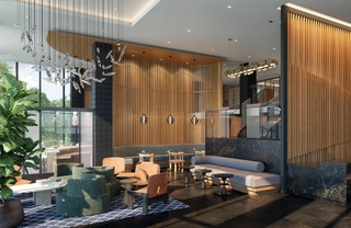 high-ceilinged lobby area with comfortable modern seating, tables, and chairs