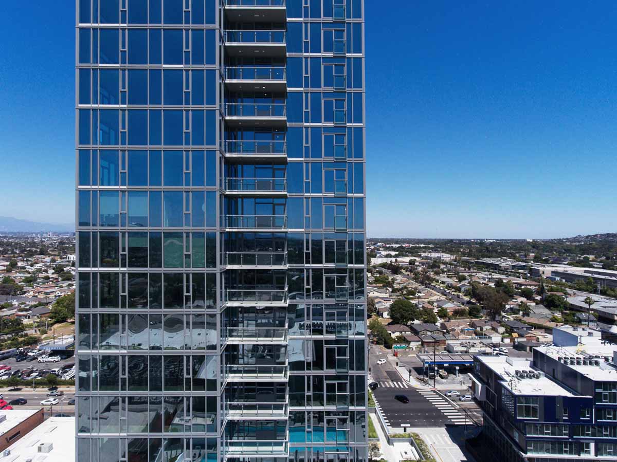 ARQ Residences — View of the tower halfway up with Culver City and LA horizon in background.