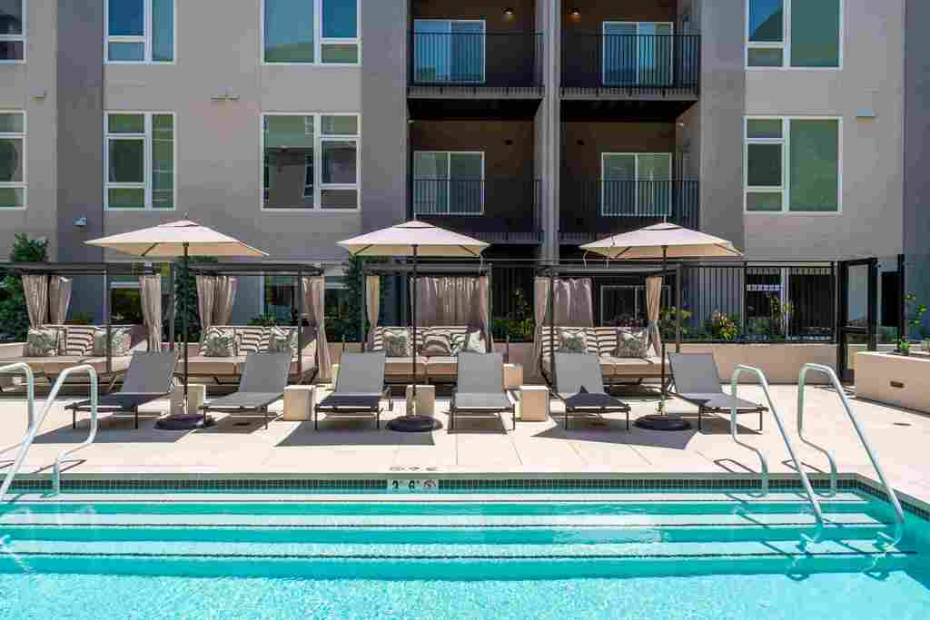 Image showcasing Belmont Apartments w Luxury Pool, EV Parking, Pet-Friendly & More