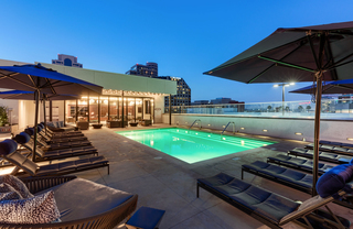 Swimming pool lit up at night.