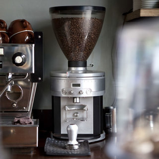 Close up of a coffee grinder in a cafe