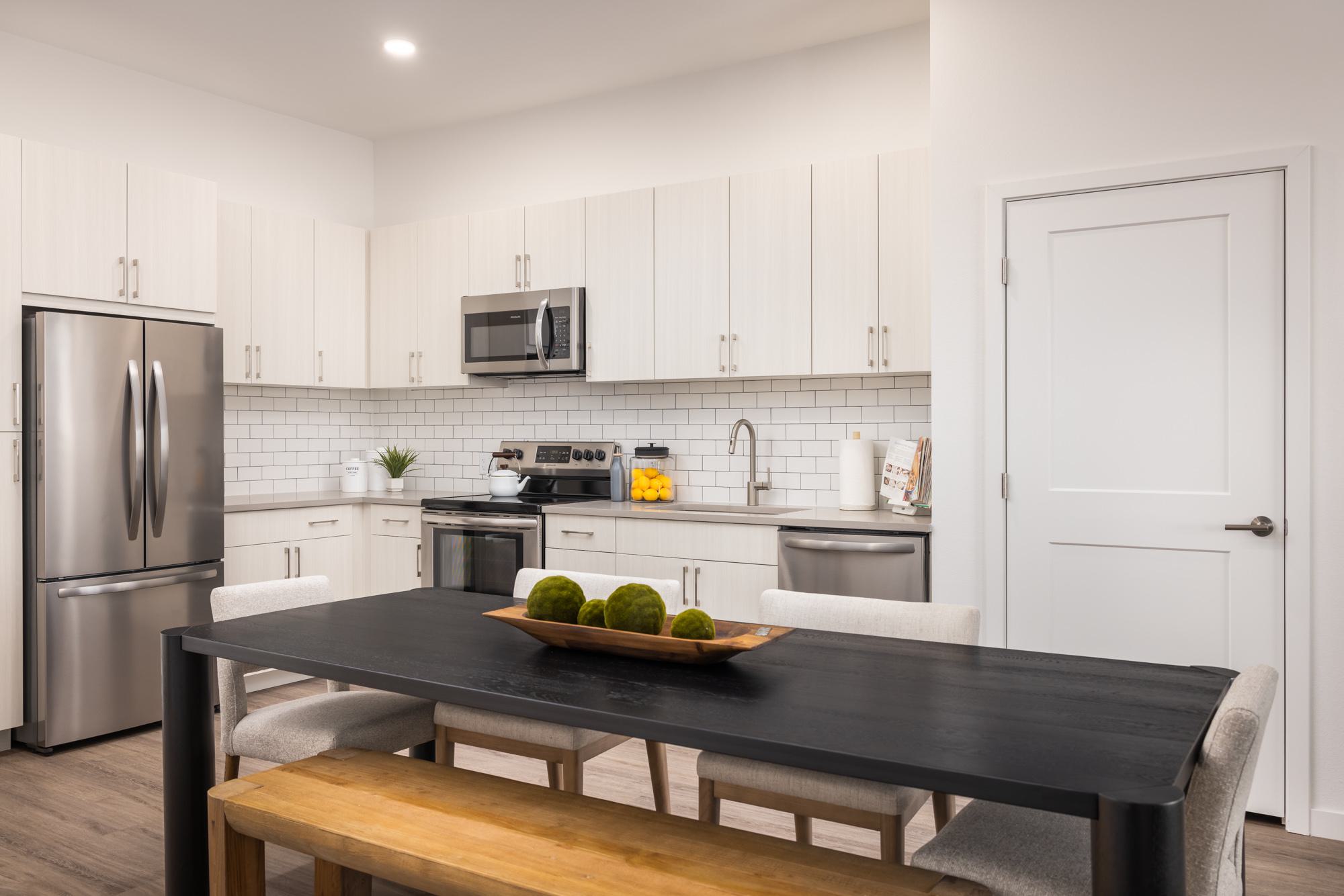 Dining room table with view of kitchen
