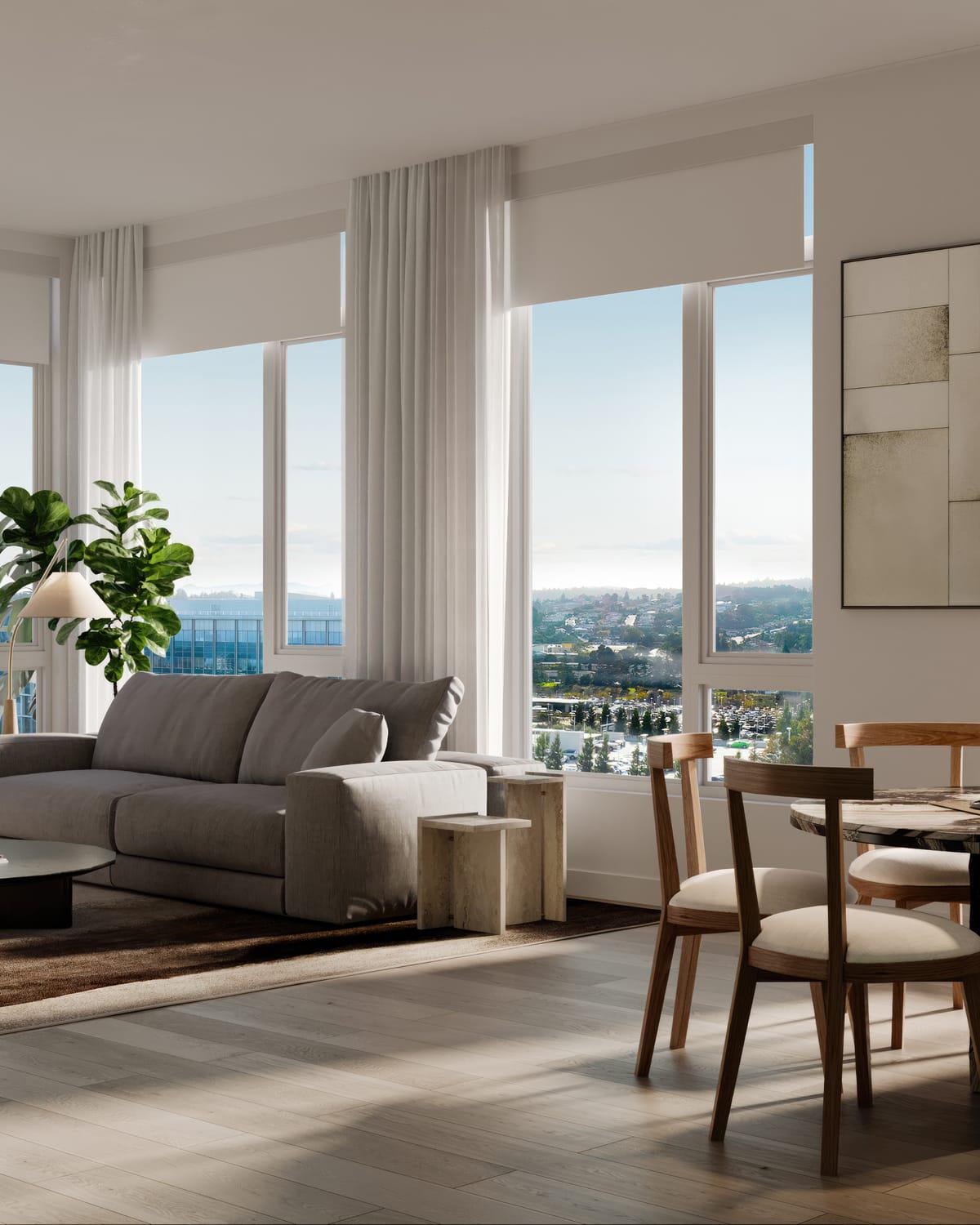 A bright, modern apartment interior with floor-to-ceiling windows framing expansive views of Burlingame. The panorama includes tree-lined neighborhoods, mid-rise buildings, and the rolling foothills of the Peninsula in the distance.