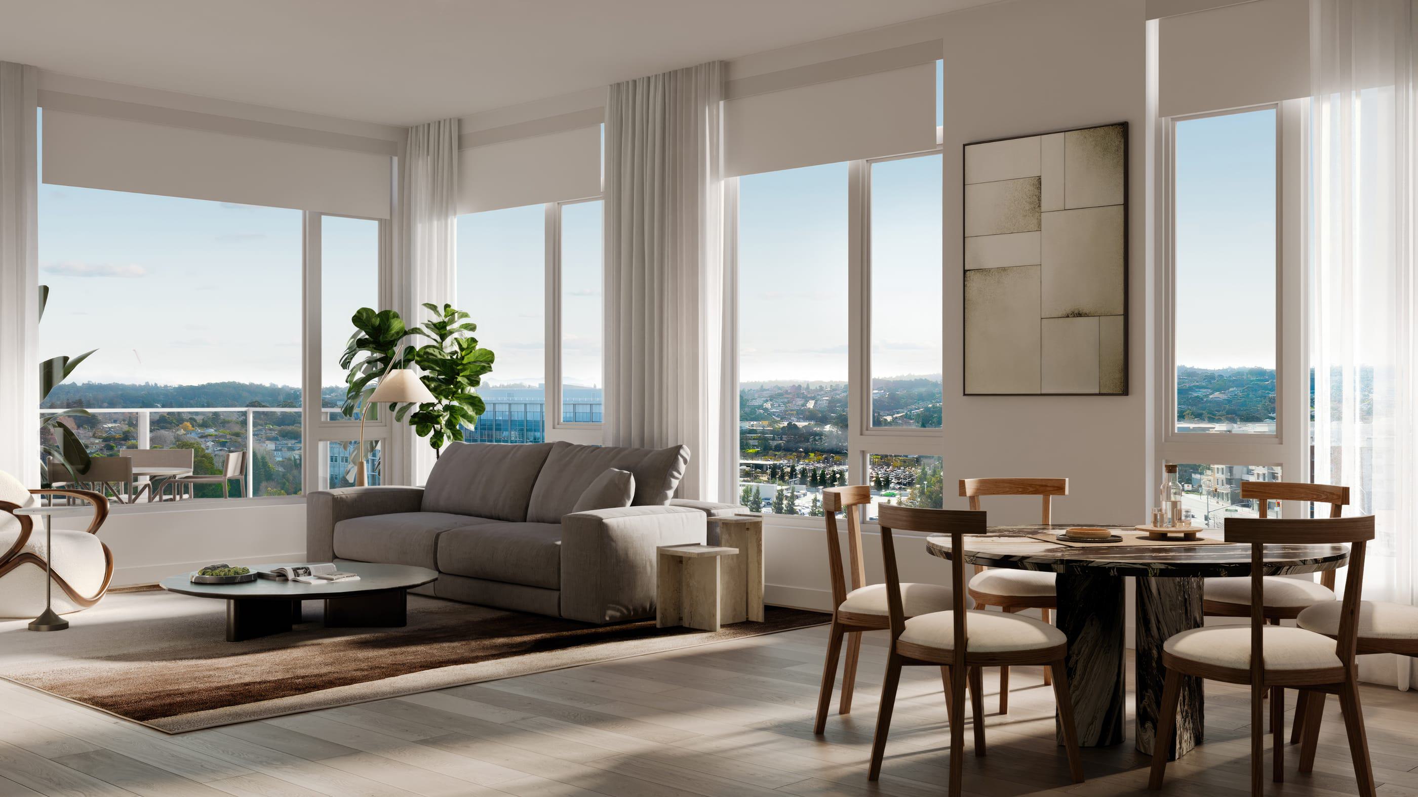 A bright, modern apartment interior with floor-to-ceiling windows framing expansive views of Burlingame. The panorama includes tree-lined neighborhoods, mid-rise buildings, and the rolling foothills of the Peninsula in the distance.