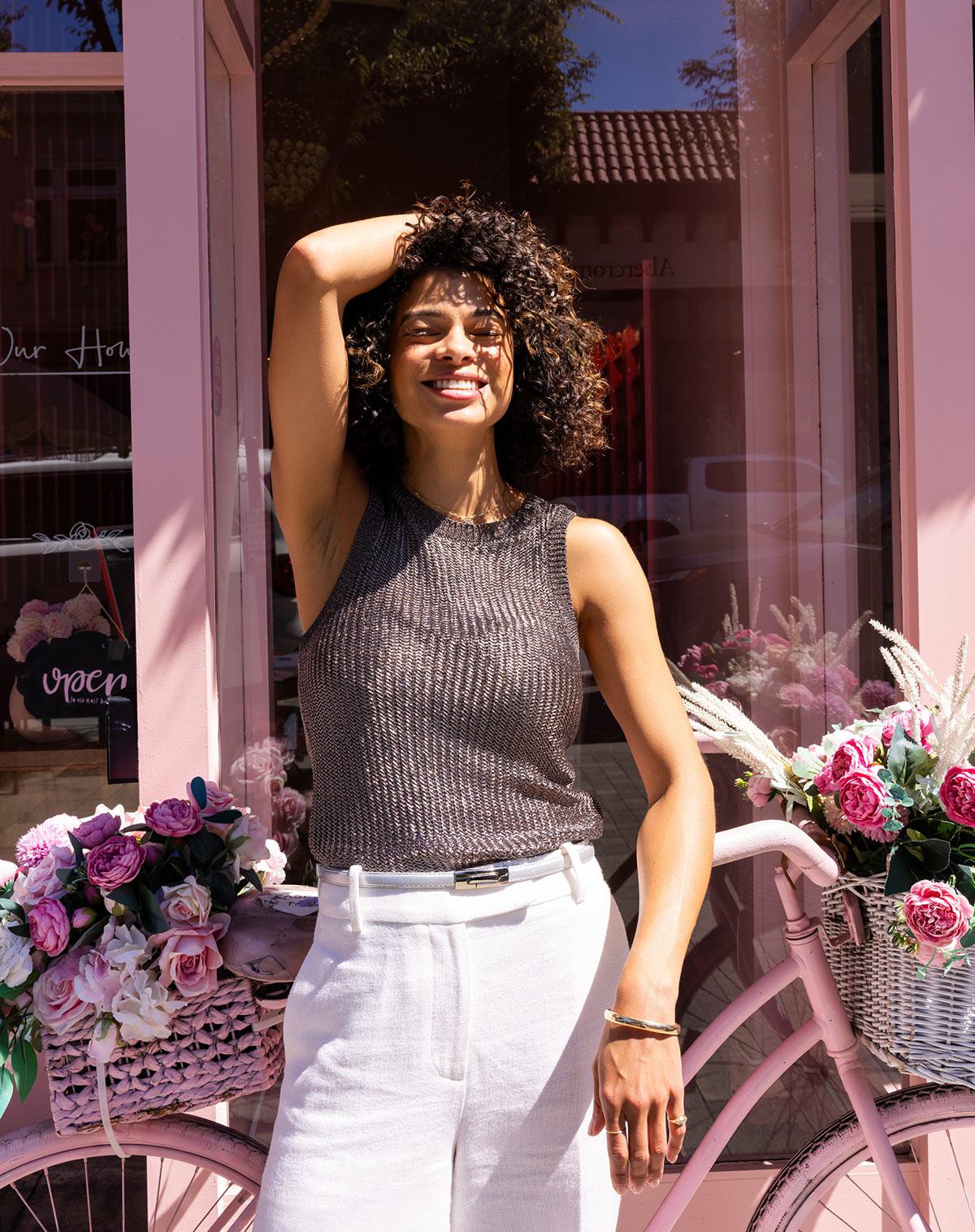 Woman in front of florist shop