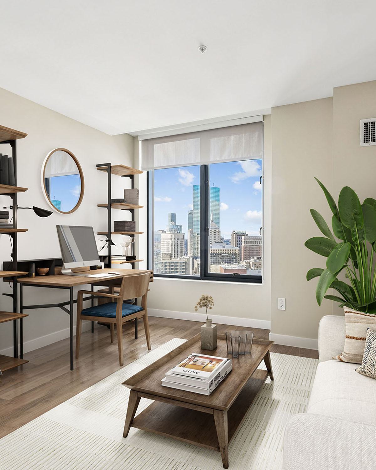 Living room and workspace with hardwood floors, a downtown Boston city view, and mid-century modern furnishings.