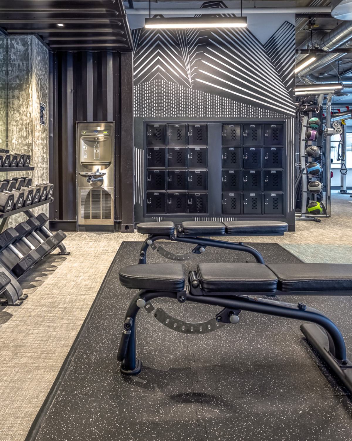 Fitness center with lockers, cardio machines and weight equipment