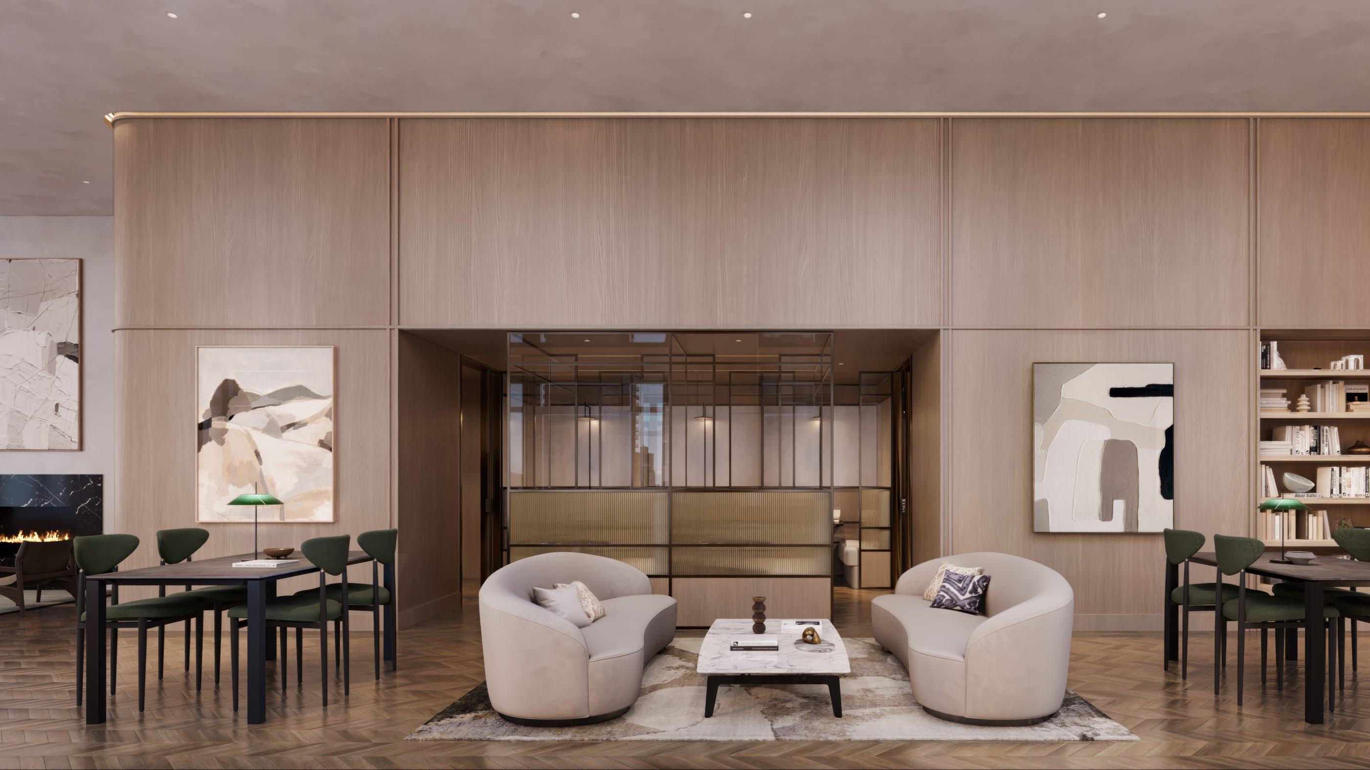 Stylish coworking lounge at Maison 78 with curved cream sofas, a marble coffee table, abstract artwork, parquet wood floors, built-in bookshelves, and green-accented dining-style desks flanking the seating area. A glass-enclosed meeting room sits at the center of the space.