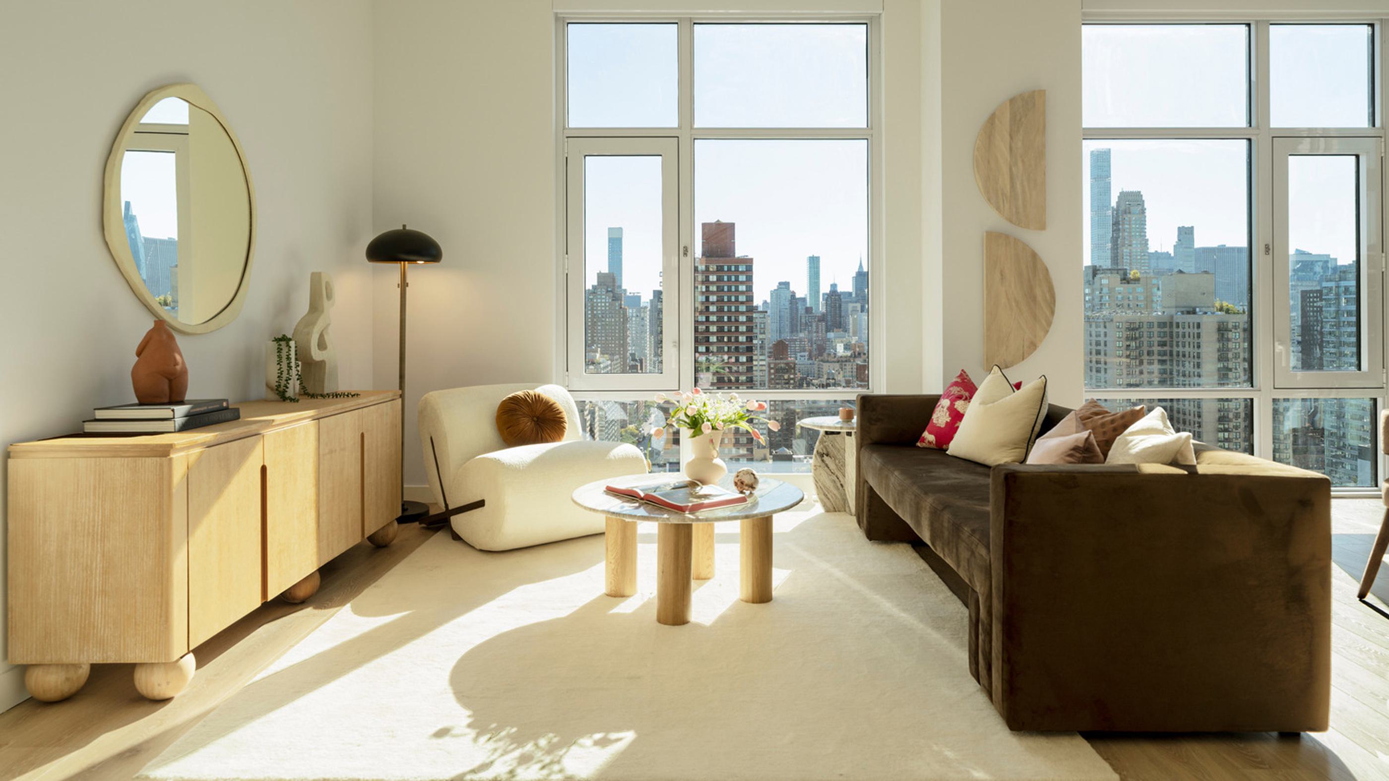 luxurious open-concept living space with floor-to-ceiling windows, a marble kitchen island, modern dining area, and a cozy lounge with panoramic city views.