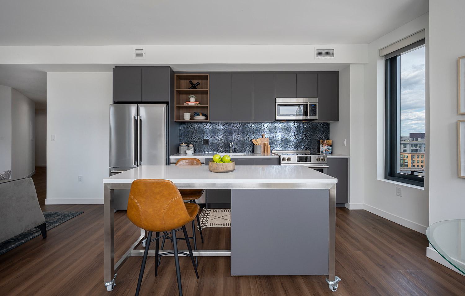 Luxury high-rise apartment interior open kitchen at The Sudbury in downtown Boston, MA