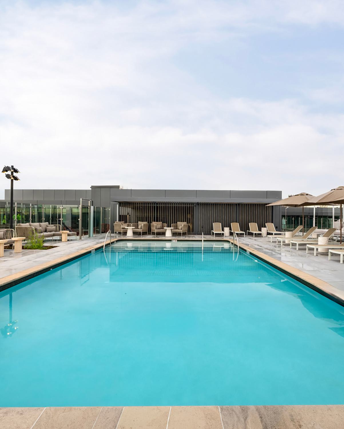 Roof Pool at Zephyr in Woodley Park, DC, featuring expansive views, loungers and cabanas.
