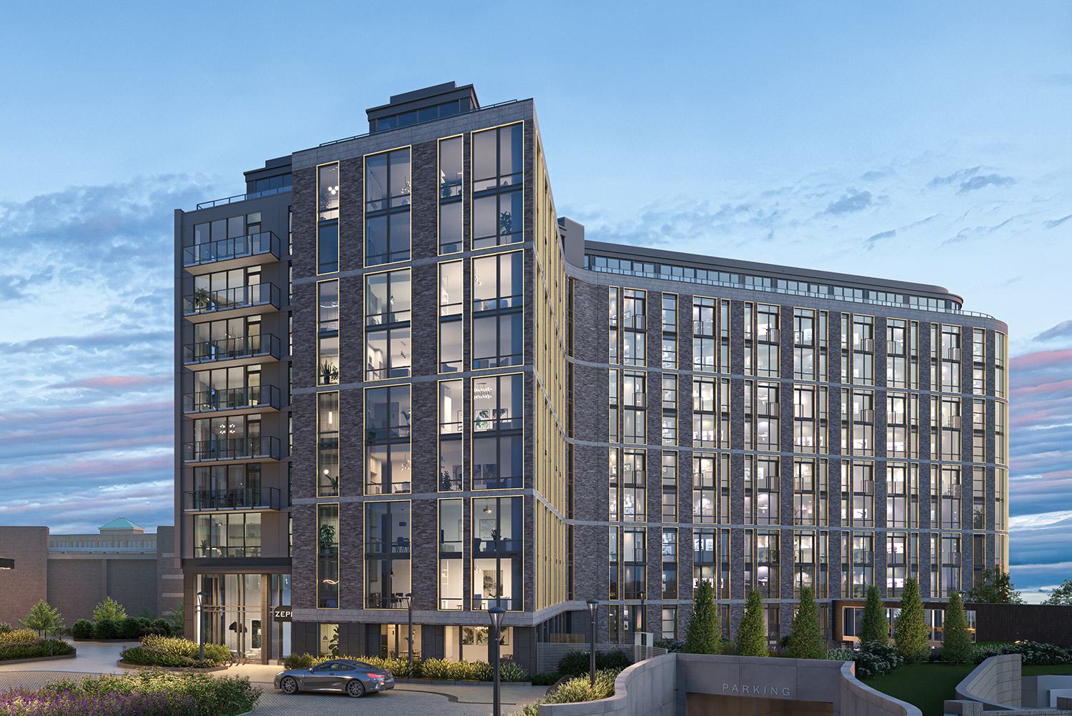 Exterior view of Zephyr in Woodley Park, DC, at dusk, showcasing its sleek glass façade with modern architectural lines, private balconies, and warm interior lighting visible through floor-to-ceiling windows.