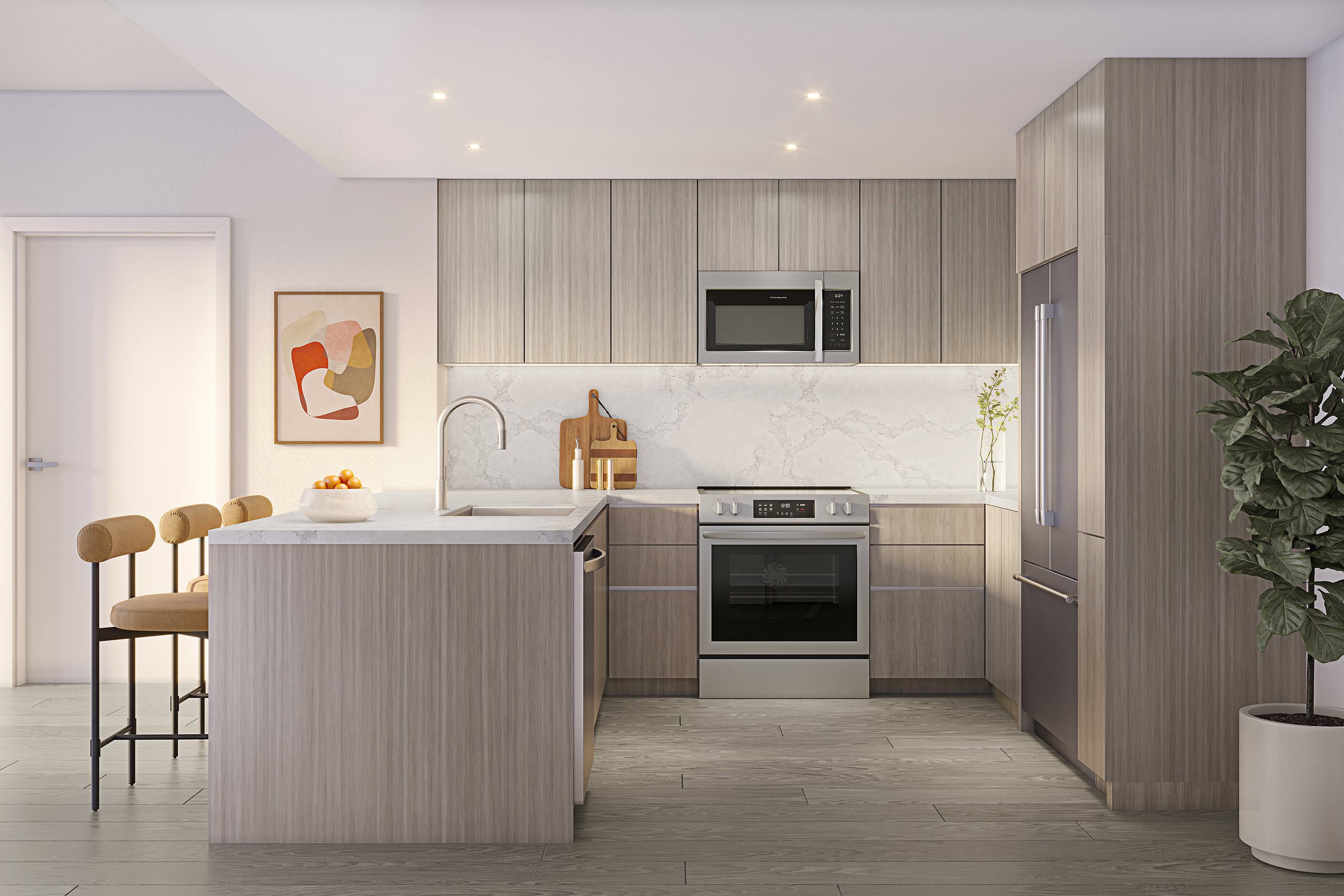 Modern kitchen at Zephyr in Woodley Park, DC, featuring light wood cabinetry, sleek integrated appliances, a marble backsplash, quartz countertops, and a peninsula with seating for two.