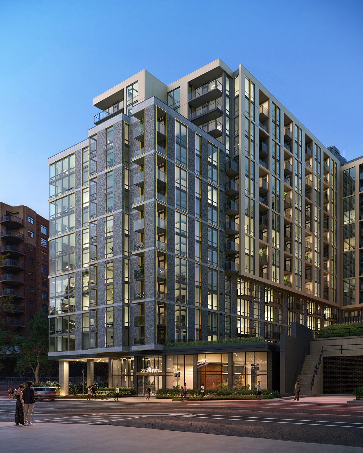 Street-level view of Zephyr’s modern exterior at dusk, showcasing its sleek glass façade, clean architectural lines, and softly lit interiors with landscaped surroundings.