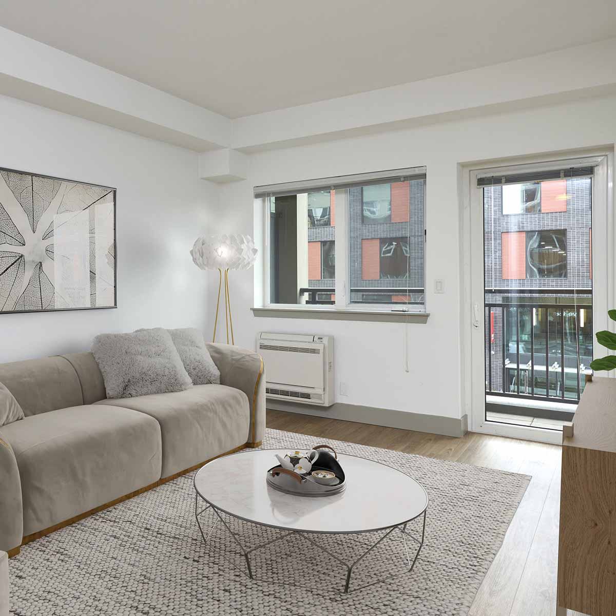 Modern apartment living room with neutral-toned furniture, large windows, and a private balcony.