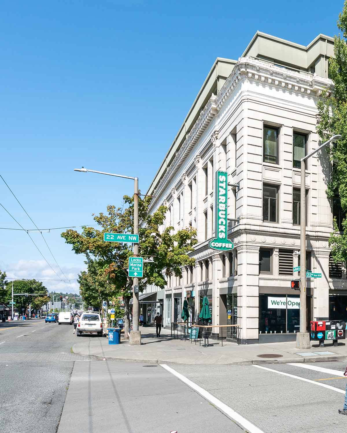 Corner view of a historic building housing Starbucks at 22nd Ave NW and NW Market Street in Ballard, Seattle.