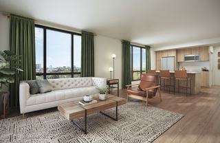 apartment with modern kitchen and oversized windows with views of a green canopy of trees and low to mid-rise seattle buildings in the distance