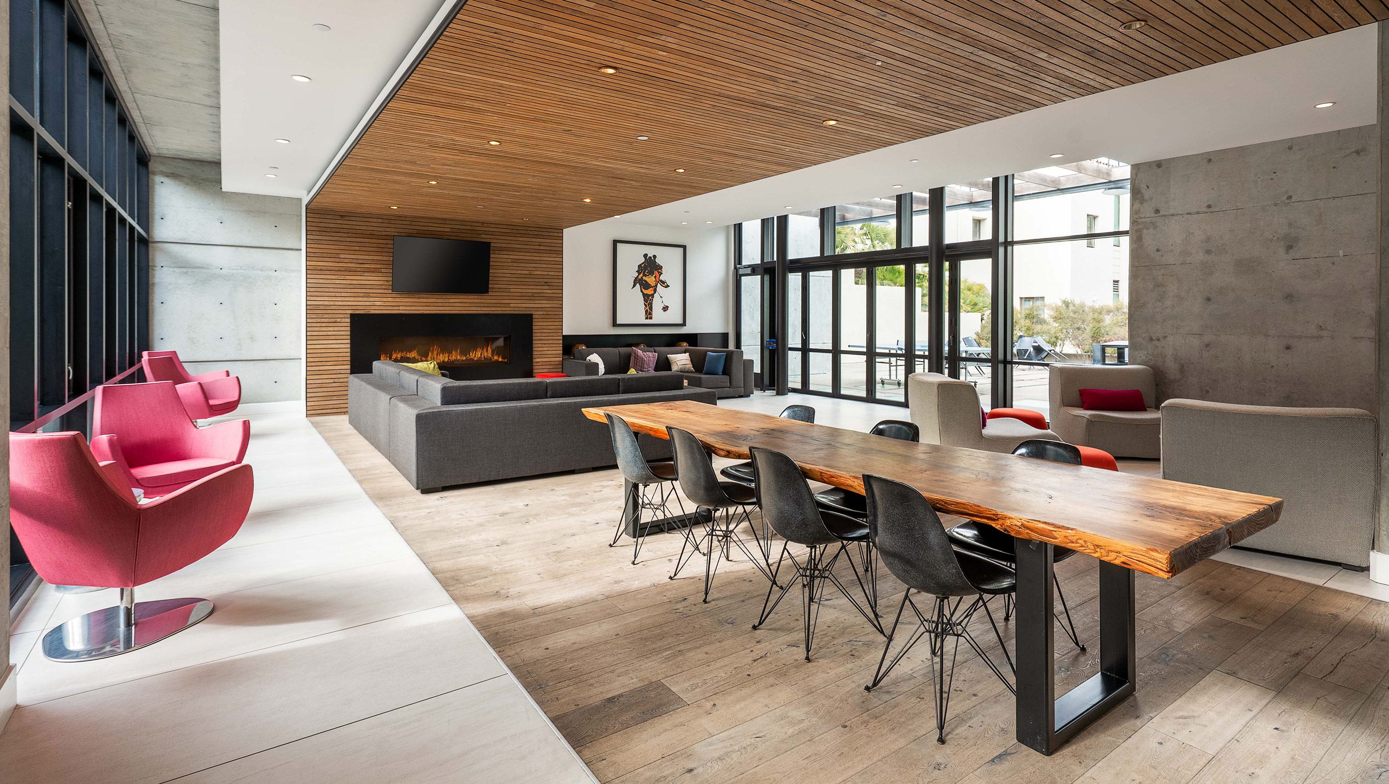 clubhouse with lounge furniture, kitchen and fireplace