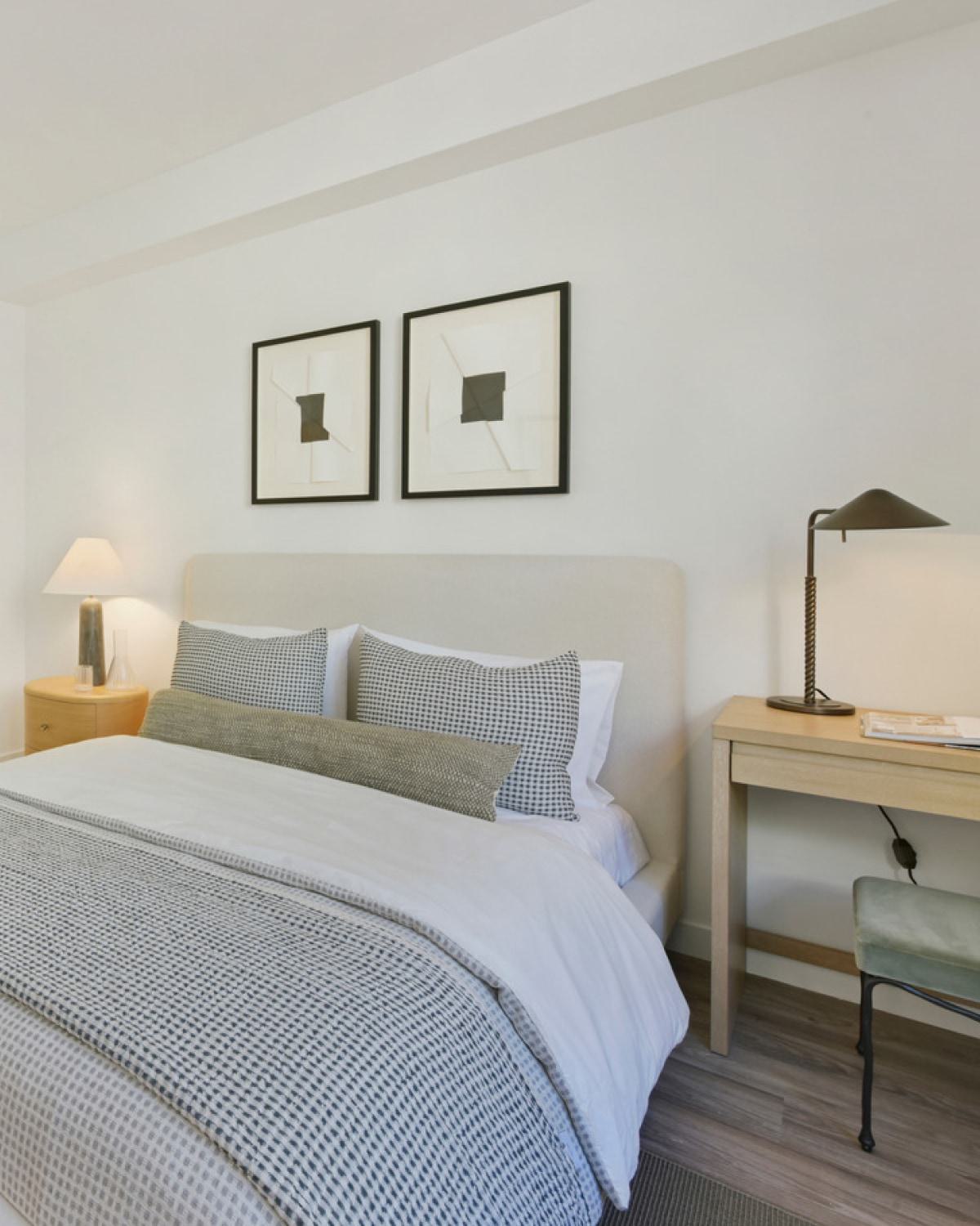 A modern bedroom in the Alchemy mid-rise apartment building.