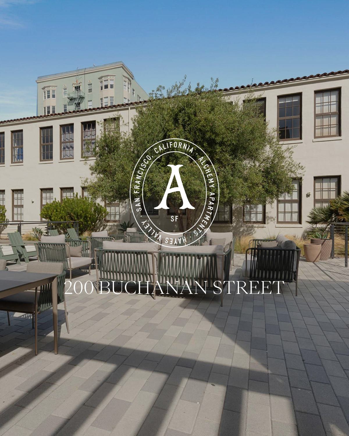 Exterior of Alchemy Apartments with landscaped courtyard and lounge seating