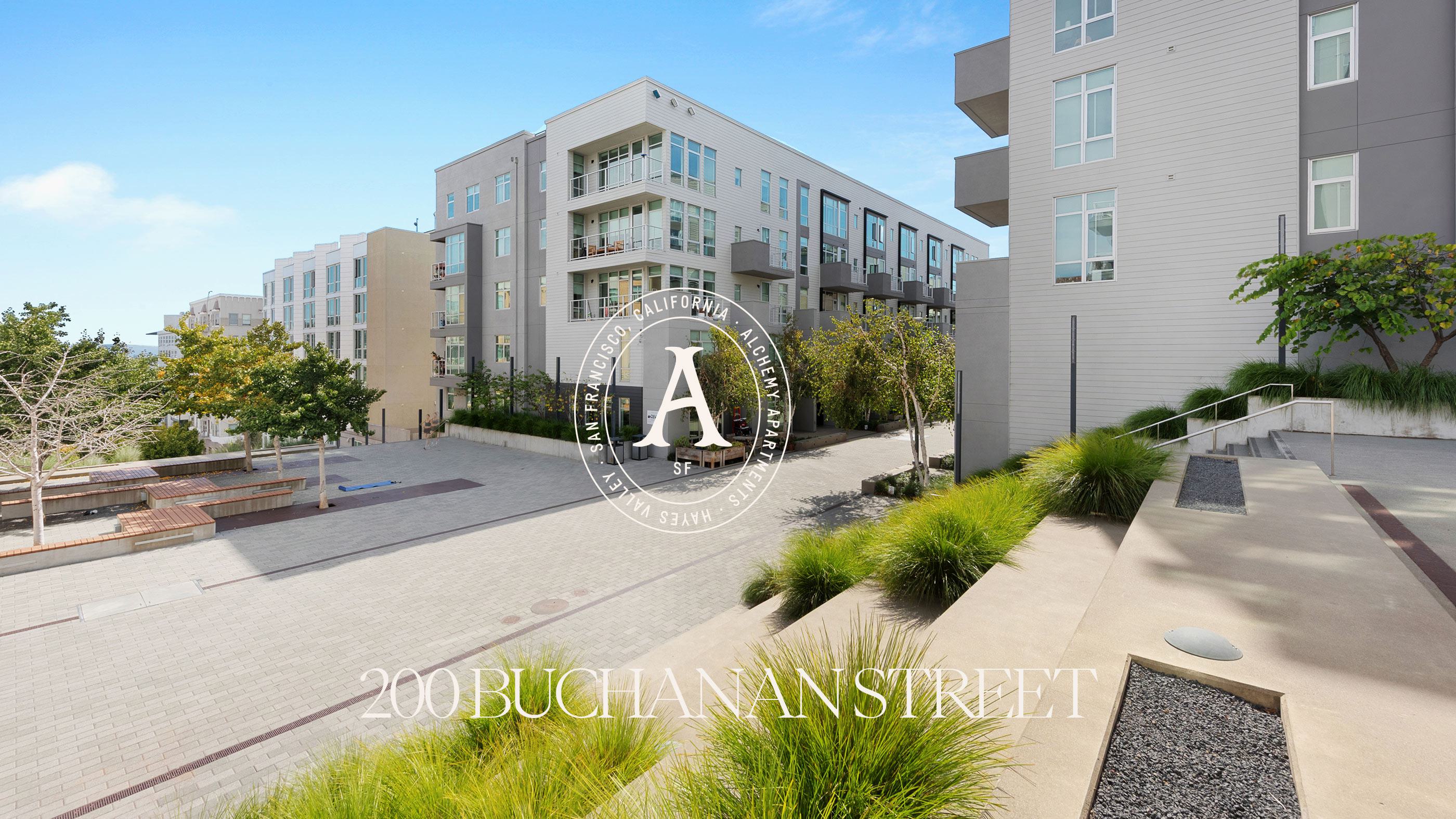Exterior of Alchemy Apartments with open courtyard, stairs and modern landscaping