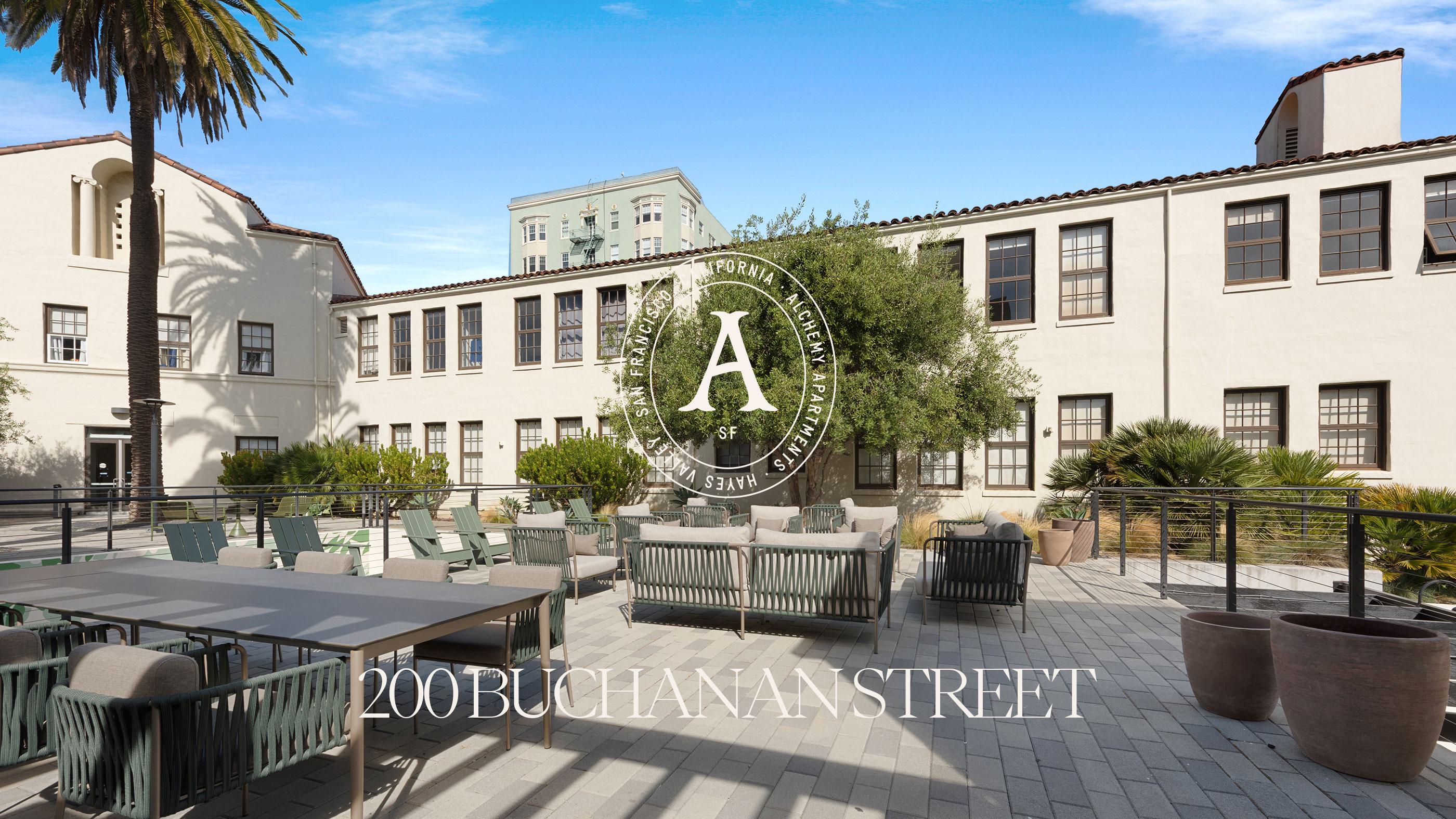 Exterior of Alchemy Apartments with landscaped courtyard and lounge seating