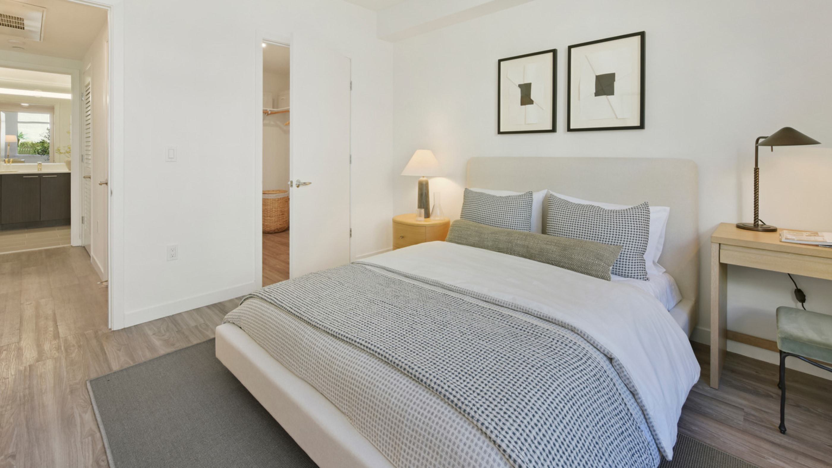 A modern bedroom in the Alchemy mid-rise apartment building.