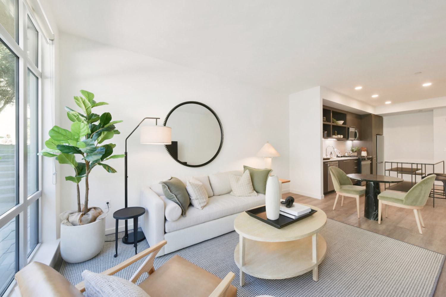 Modern, living room and kitchen filled with natural light