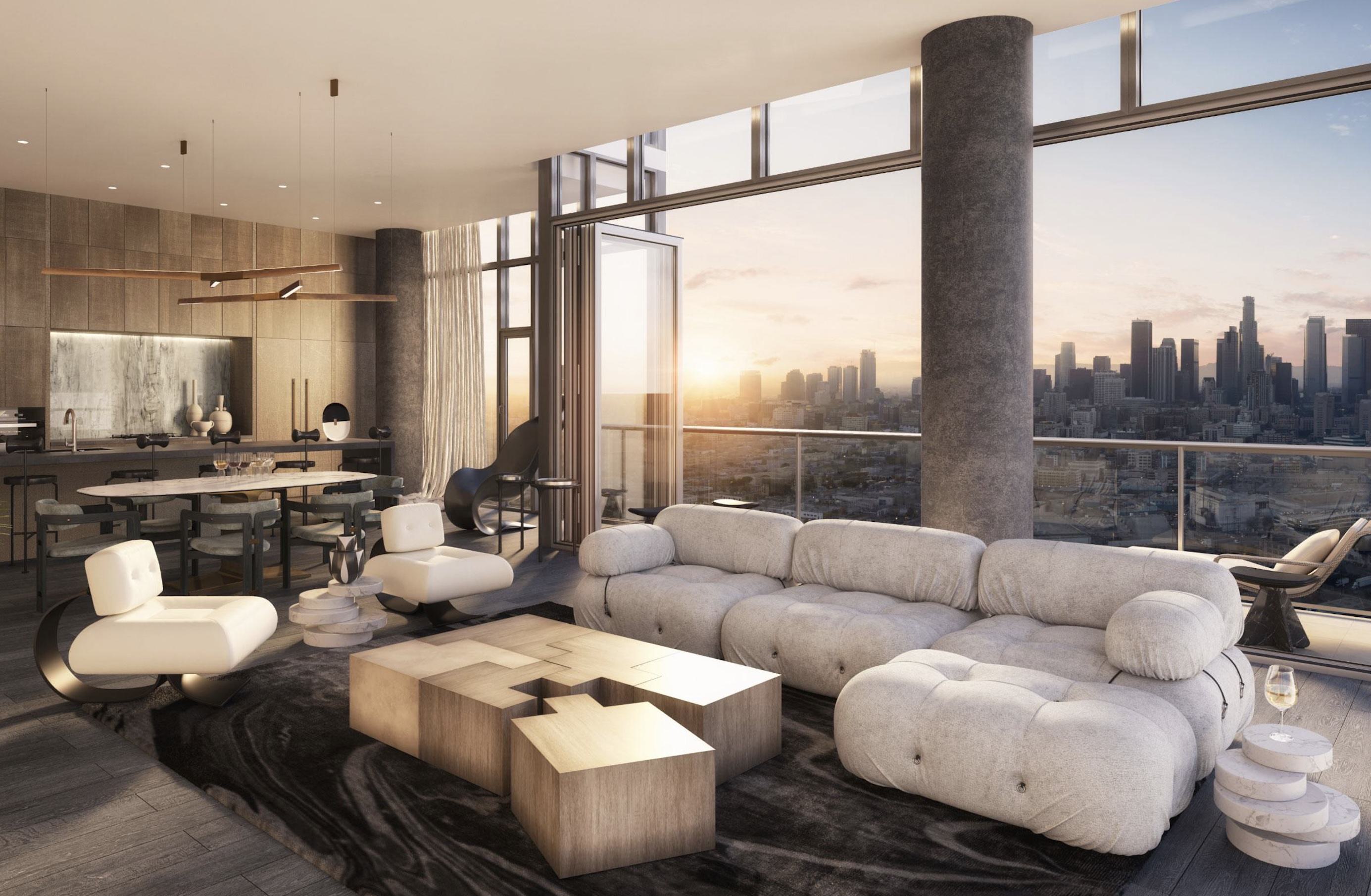 Penthouse living room at Alloy with modern furnishings, floor-to-ceiling windows, and folding glass doors opening onto a private terrace with sweeping downtown LA skyline views at sunset.