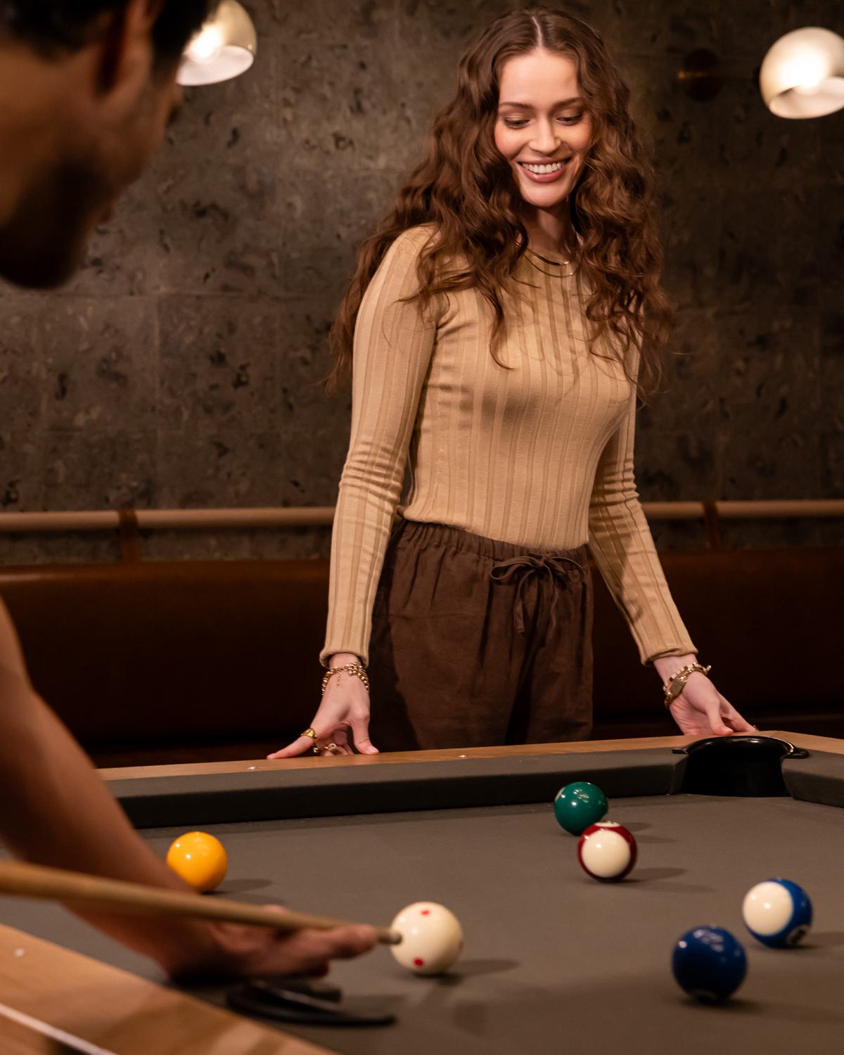 Couple playing pool