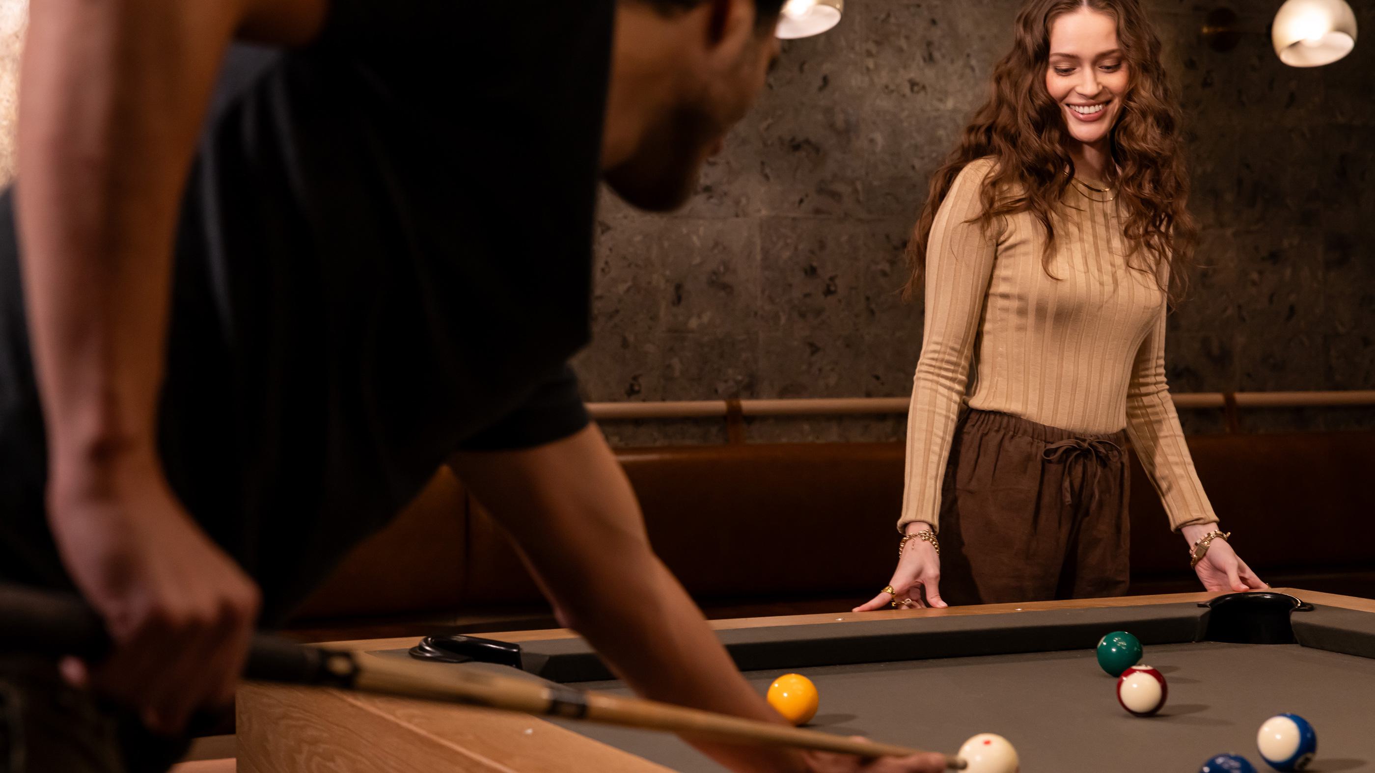 Couple playing pool