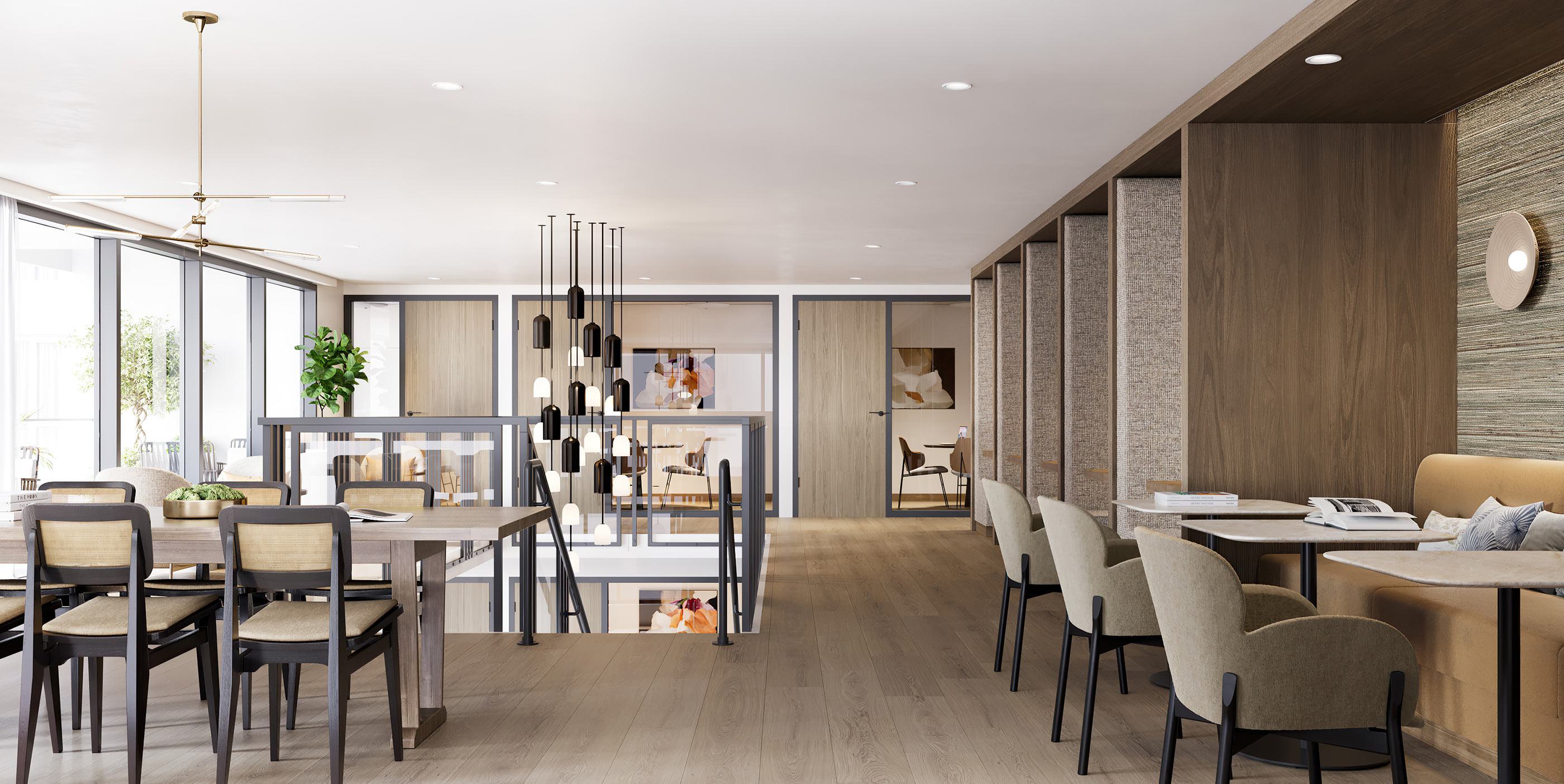 Modern,  mid-rise Revery apartment building at dusk, with sleek glass corner windows, warm interior lighting, and the name “REVERY” illuminated at the top. The design features clean lines, wood and brick textures, and landscaped trees lining the sidewalk for an inviting urban presence.