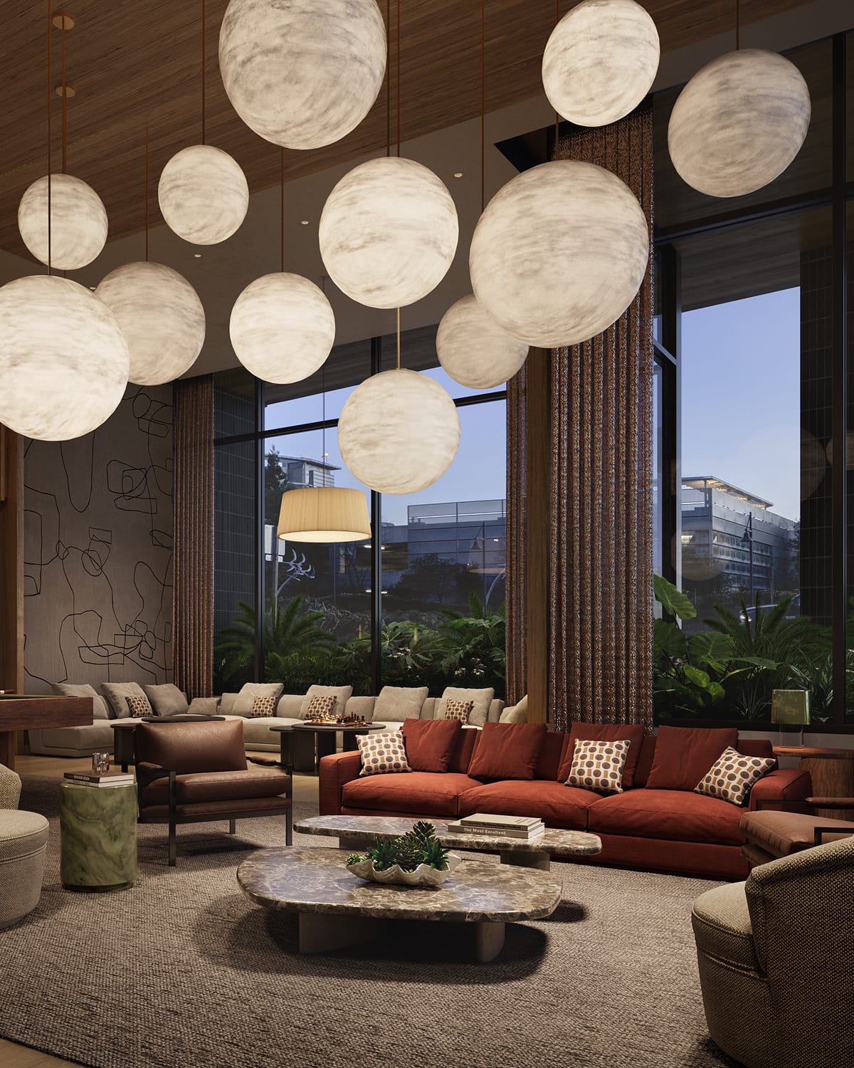 A stylish club room with sculptural globe pendant lights, textured walls, and a mix of plush seating. Floor-to-ceiling windows reveal landscaped greenery and glimpses of modern nearby buildings, creating a cozy yet connected atmosphere.