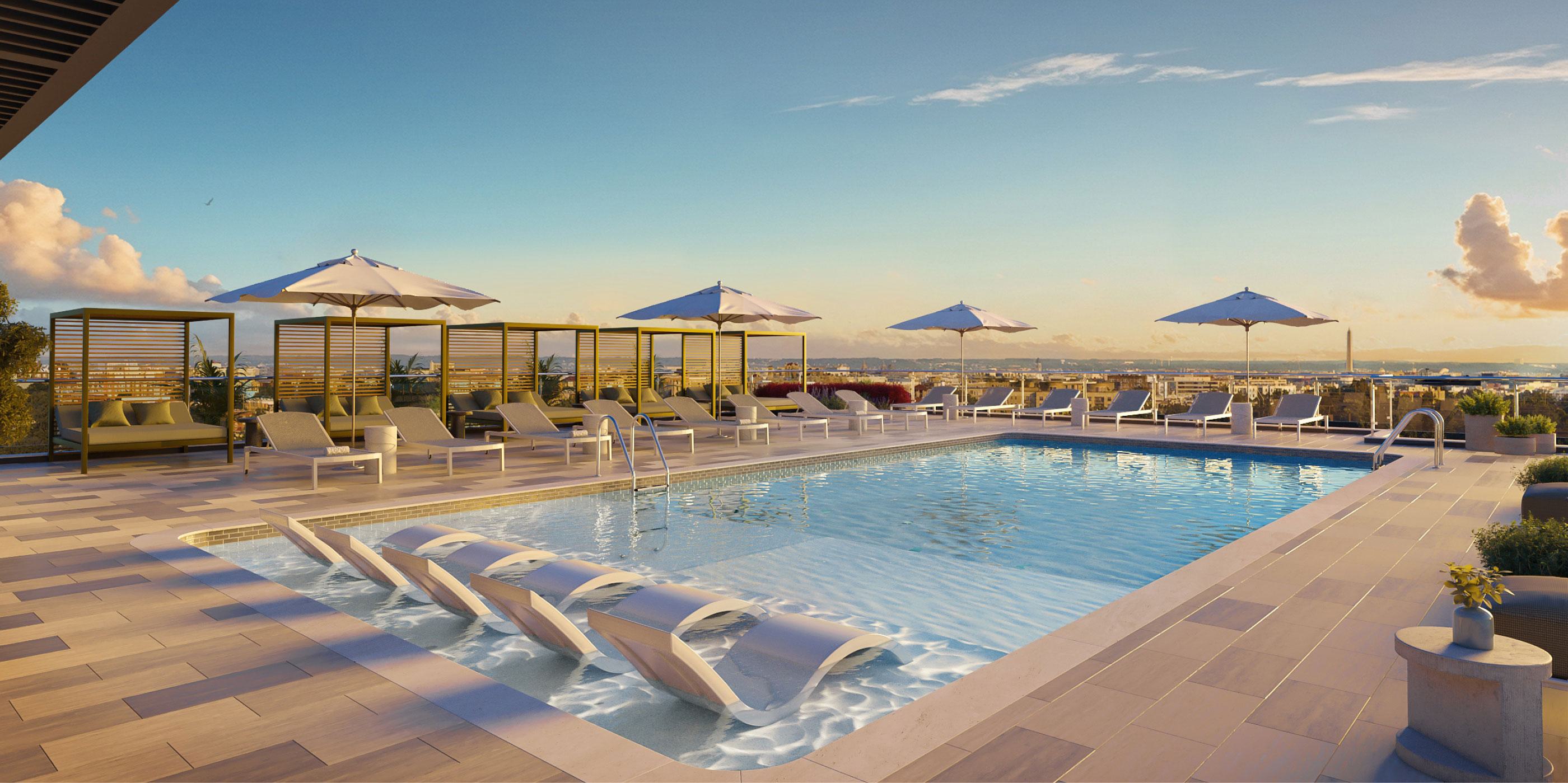 Rooftop pool at Zephyr in Woodley Park, DC, with in-water loungers, shaded cabanas, and panoramic city views, including the Washington Monument in the distance at sunset.