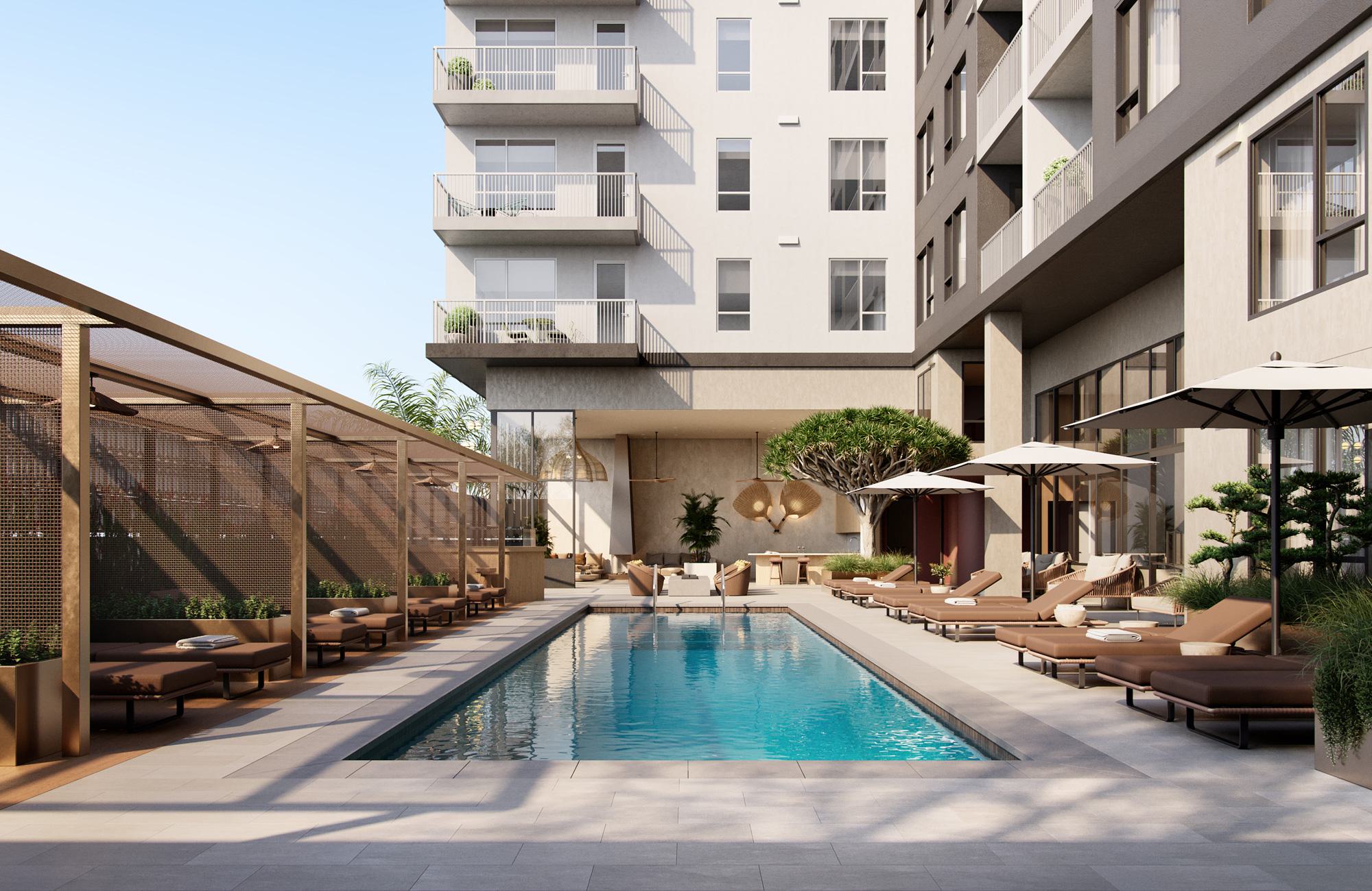 A modern outdoor pool deck at Rowyn with a sleek lap pool, shaded cabanas, cushioned loungers under umbrellas, lush greenery, and a bar-inspired lounge area at the far end.