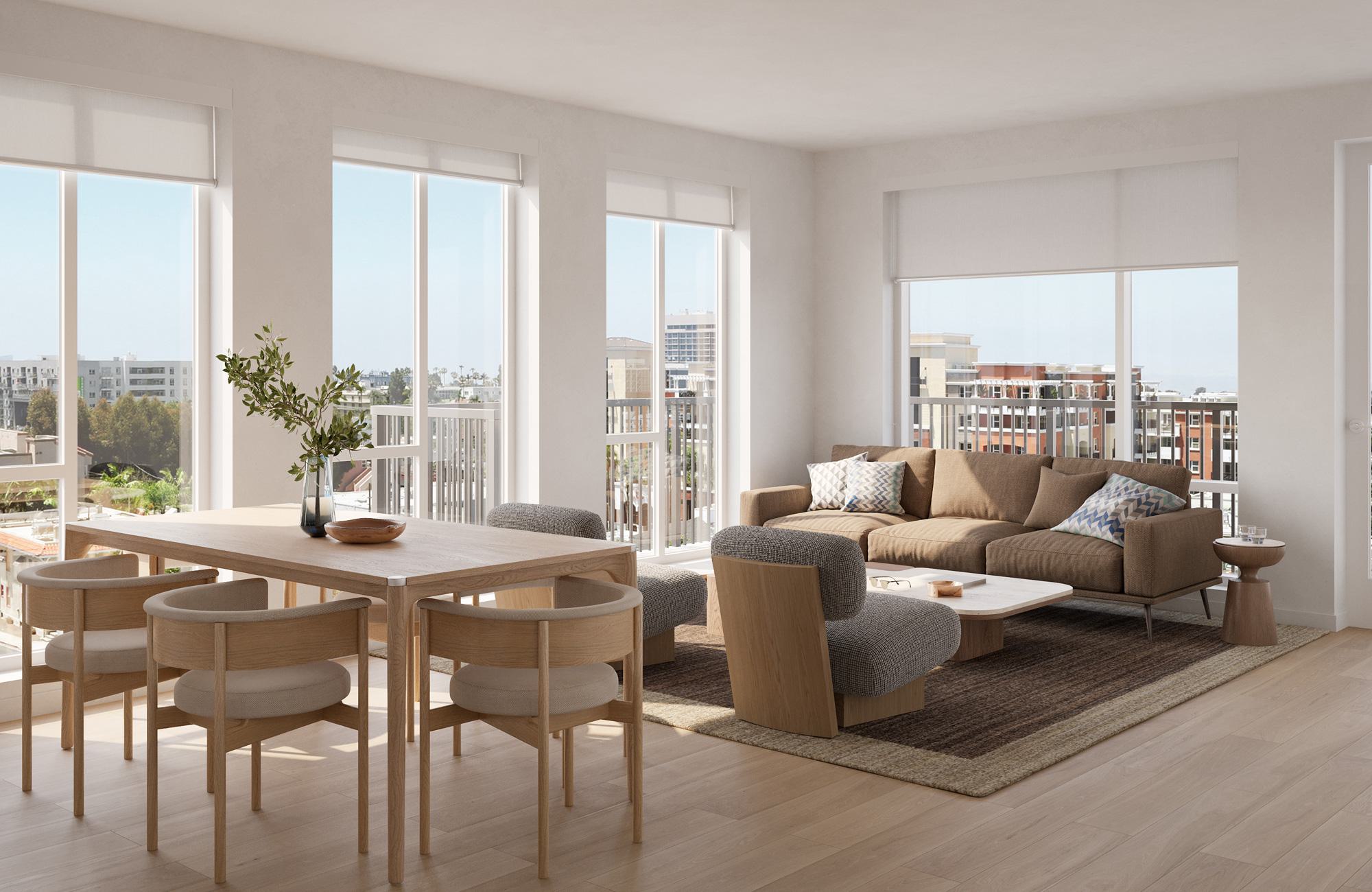 Bright, modern living and dining area with floor-to-ceiling windows and custom roller shades, light wood flooring, a tan sectional sofa with accent pillows, and a simple wood dining table with four matching chairs. The windows open to a balcony with views of Hillcrest’s mid-rise buildings, tree-lined streets, and glimpses of surrounding greenery.