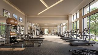 Spacious fitness center at Forge with floor-to-ceiling windows, treadmills lined along the glass, weight benches, free weights, and wall-mounted TVs above the strength area.