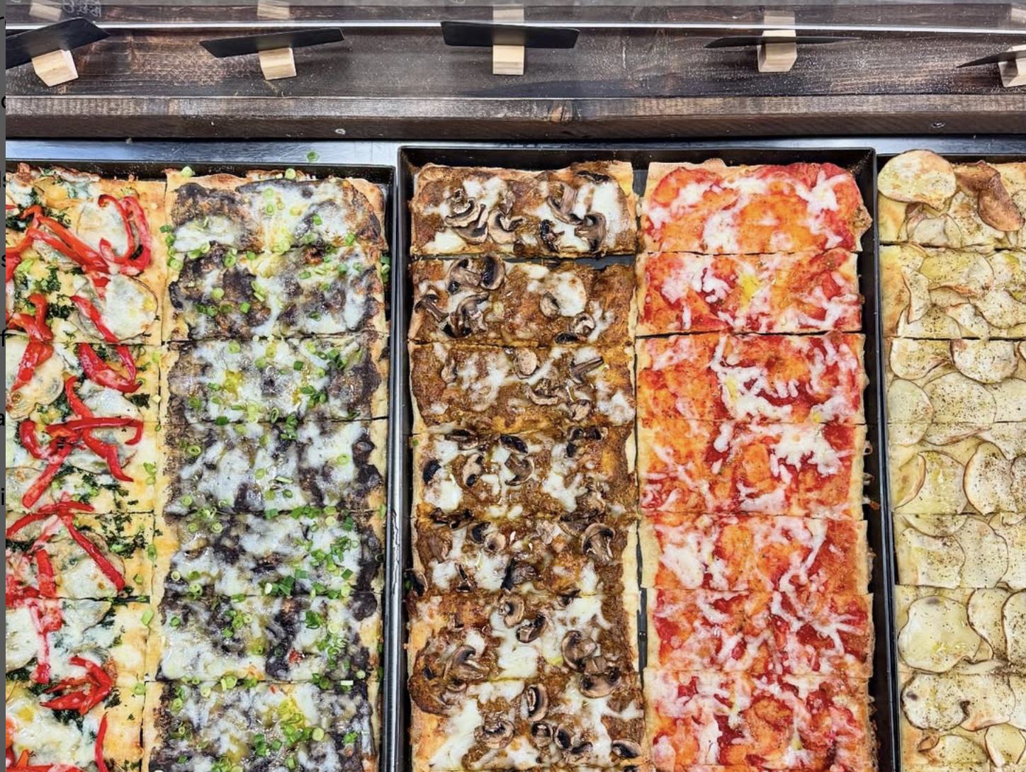 A birds eye view of the veggie and vegan lineup at pizza by Ruffin