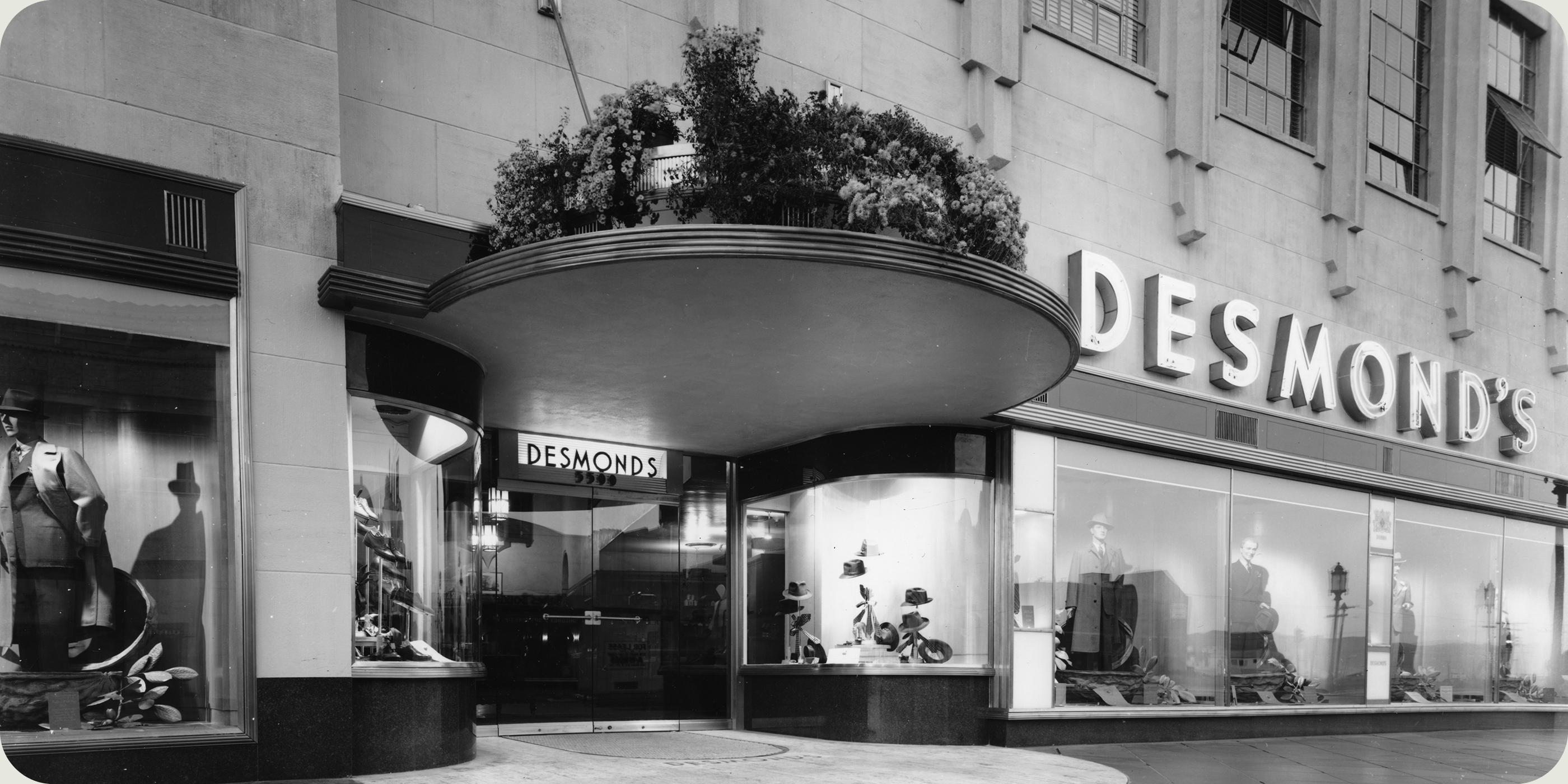 Historic photo of Desmond’s department store on Wilshire Boulevard near Miracle Mile, showcasing Art Deco architecture and vintage window displays.
