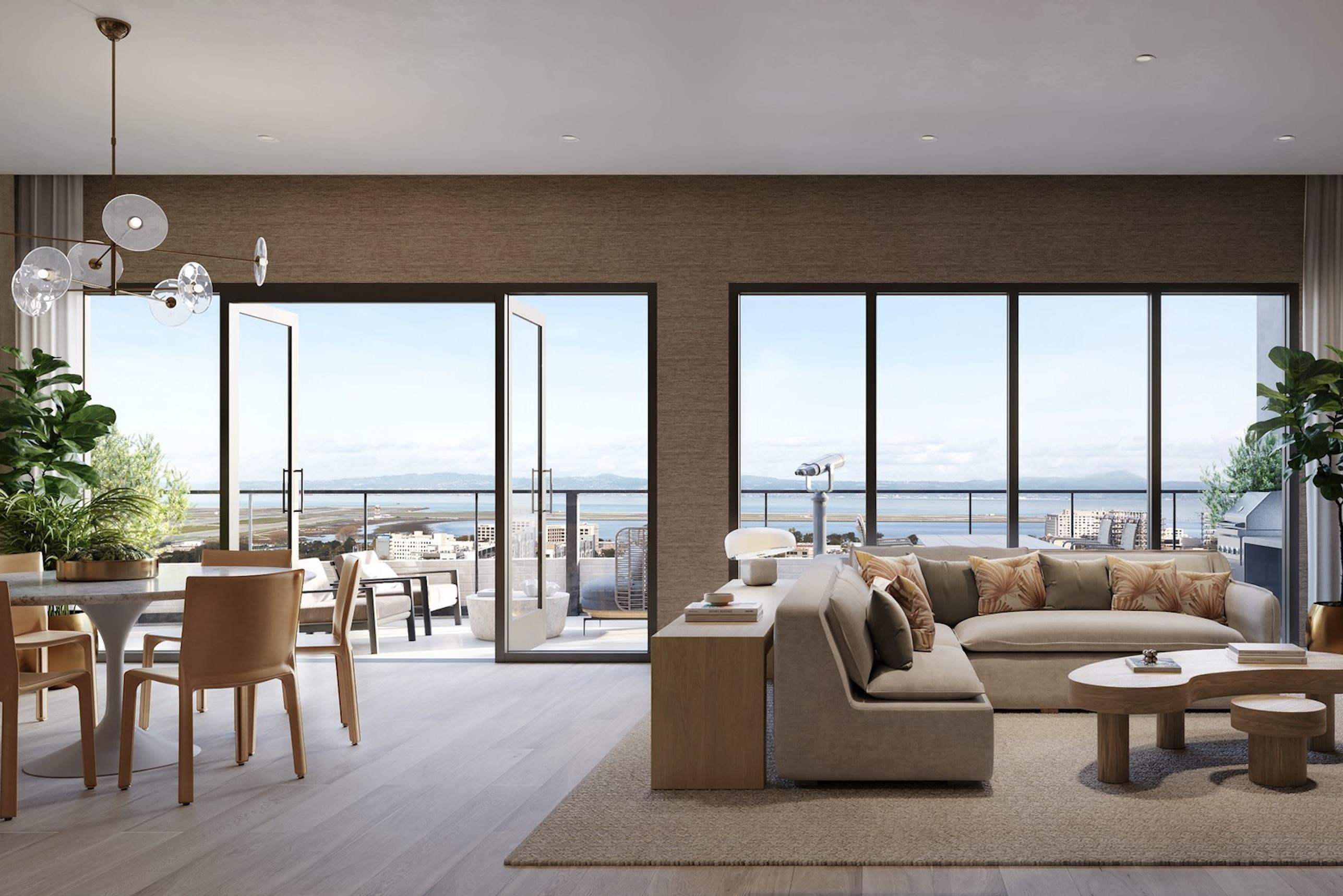 Bright, modern interior of the Sunset Lounge at Revery in Burlingame, with light wood finishes, neutral furnishings, and floor-to-ceiling windows opening to a rooftop deck overlooking the San Francisco Bay.